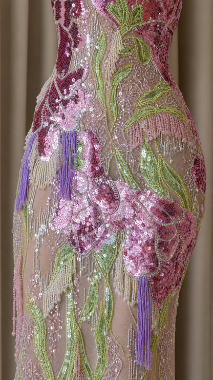 Close-up detail of sequin and bead embroidery on gown