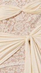 Close-up detail of lace texture and knot drape