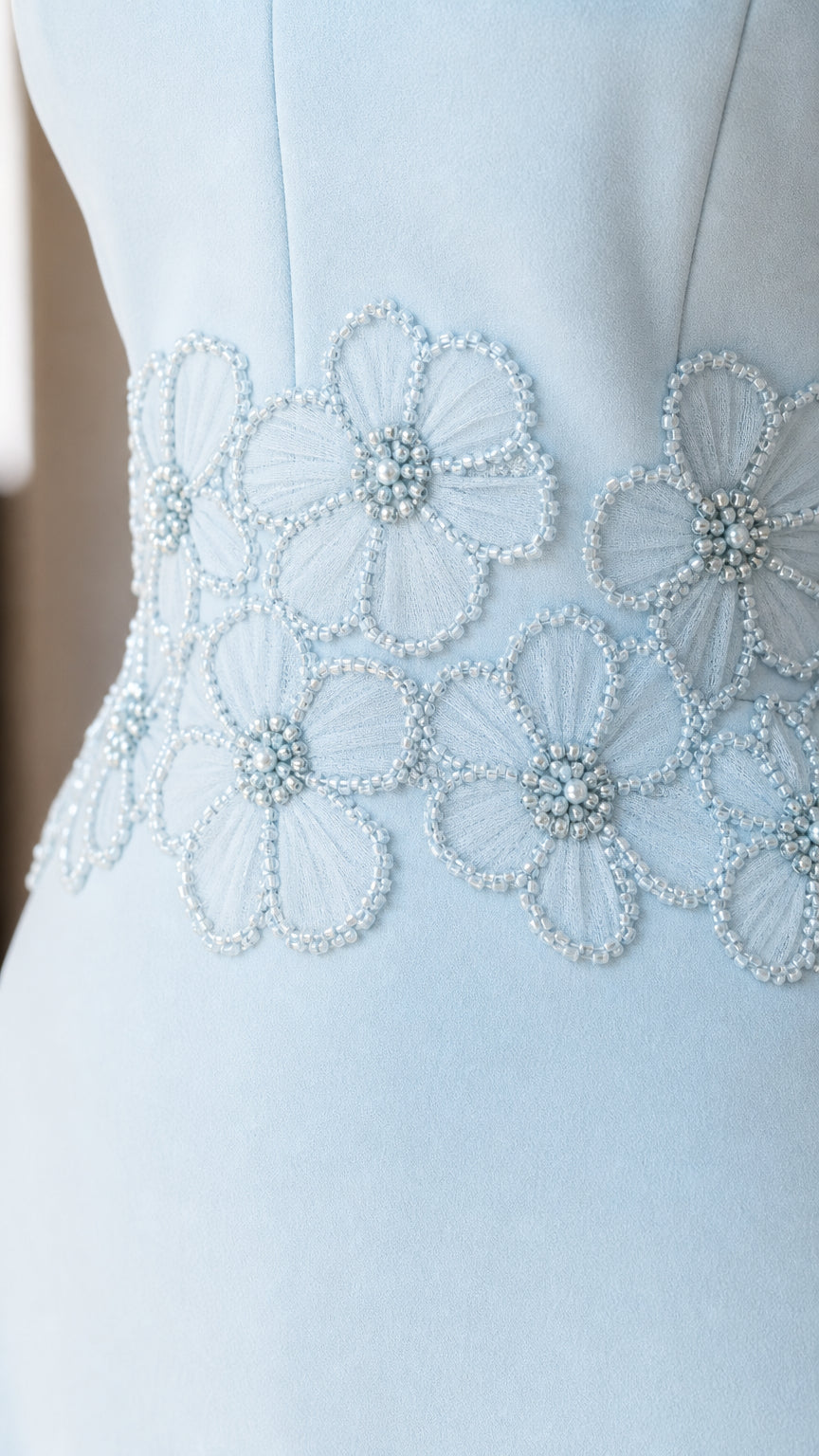 Close-up of 3D floral beaded waist detailing