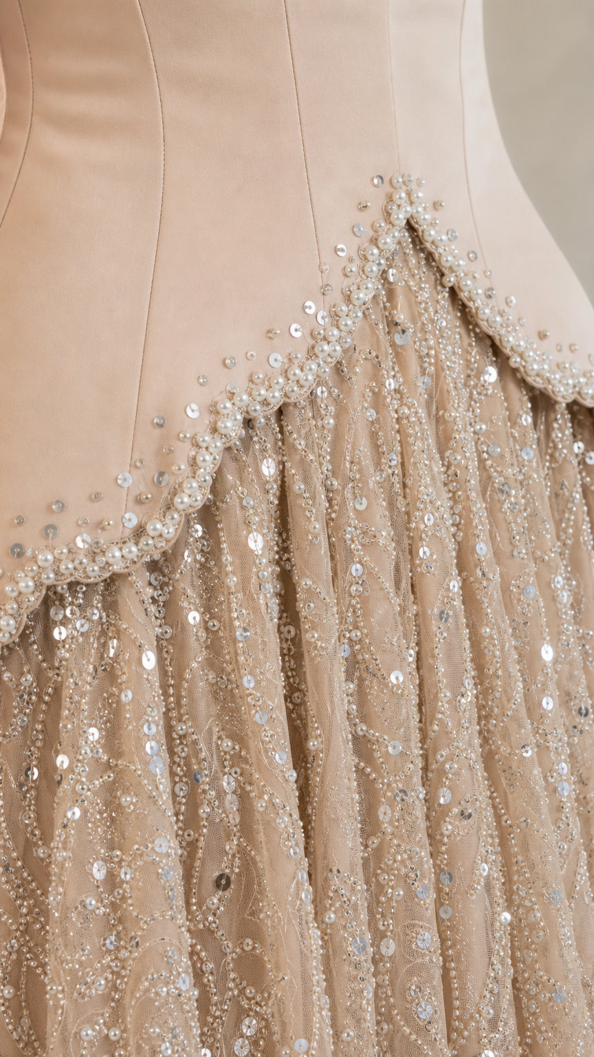 Close-up detail of embellished sweetheart neckline and sequin skirt