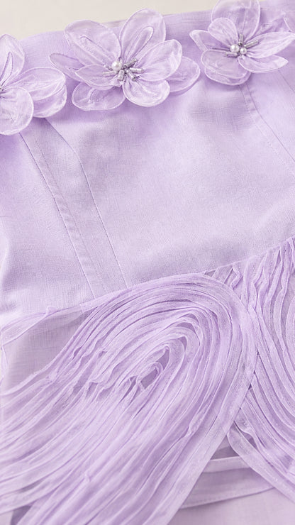 Close-up detail of 3D floral appliques and bodice on lavender dress