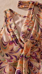 Close-up detail of halter neckline and smooth fabric texture