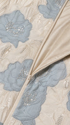 Close-up detail of floral embroidery, sequins, and side zipper