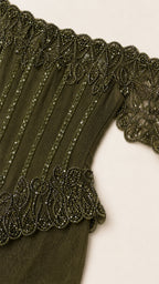 Close-up detail of beaded bodice and off-shoulder neckline
