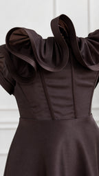 Close-up detail of structured bodice and sculptural ruffle neckline