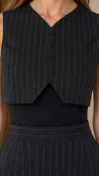 Close-up detail of black pinstripe vest top and waistband