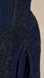 Close-up of intricate beadwork and high slit on Navy dress
