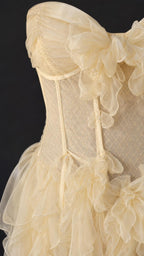 Close-up detail of structured corset and ruffles in Champagne