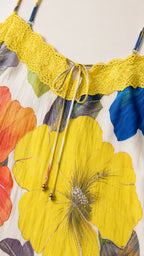 Close up of lace trim and tie-front neckline detail