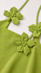 Close up of floral appliques and straps on tank top