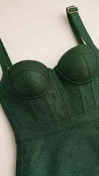 Close-up of bodice detail on green glitter midi dress