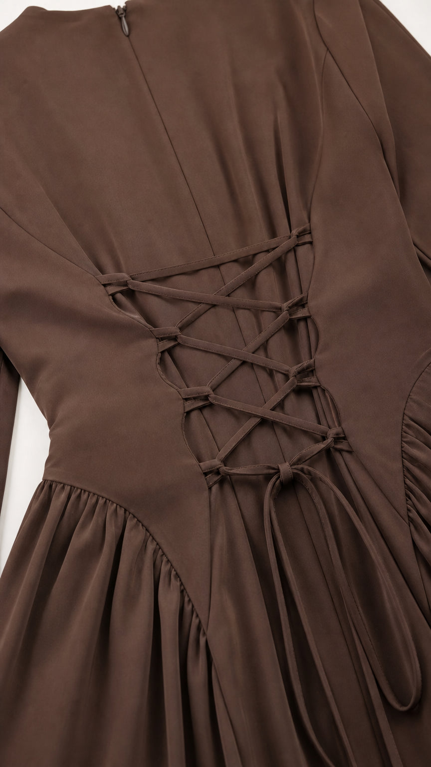 Close-up of the lace-up back design on the brown maxi dress