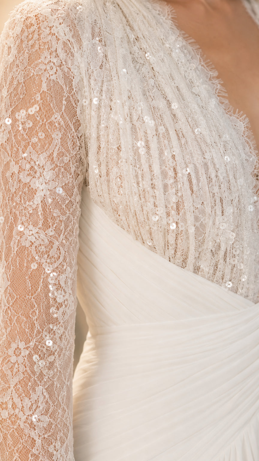 Close-up detail of sequin lace bodice and sleeve on White dress