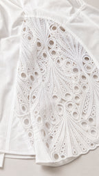 Close up texture shot of the white geometric lace panel