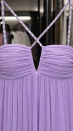 Close-up of rhinestone straps and ruched sweetheart neckline in lavender