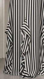 Close-up of bottom ruffle hem on striped maxi dress