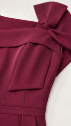 Close-up detail of shoulder bow and neckline