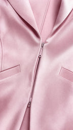 Close-up detail of blazer collar and front zipper closure