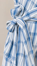 Close-up detail of the fabric texture and self-tie waist sash