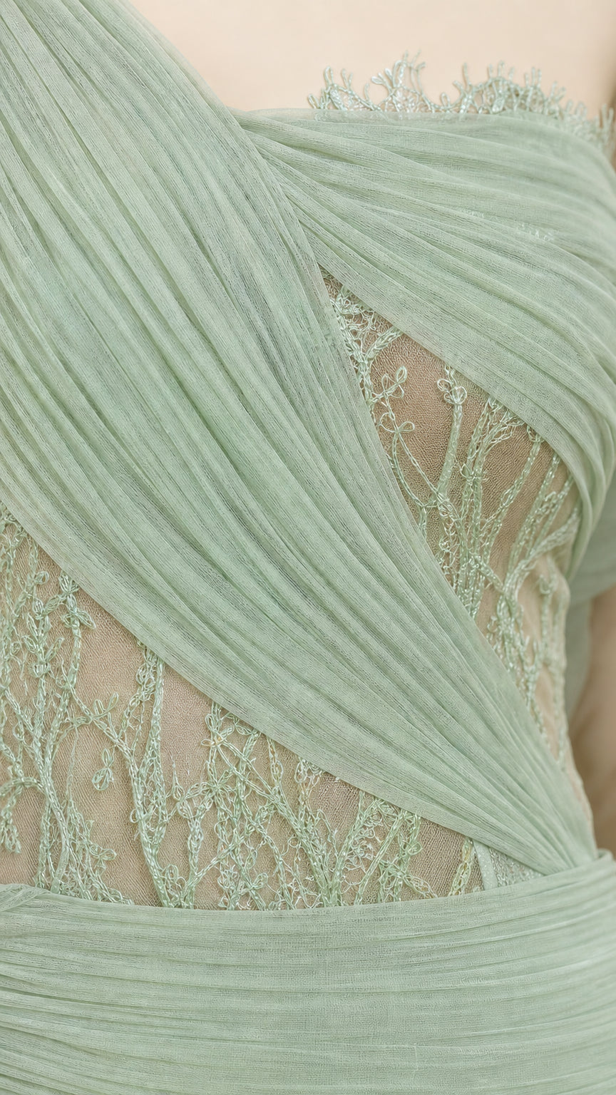 Close-up detail of draped tulle and embroidered lace bodice