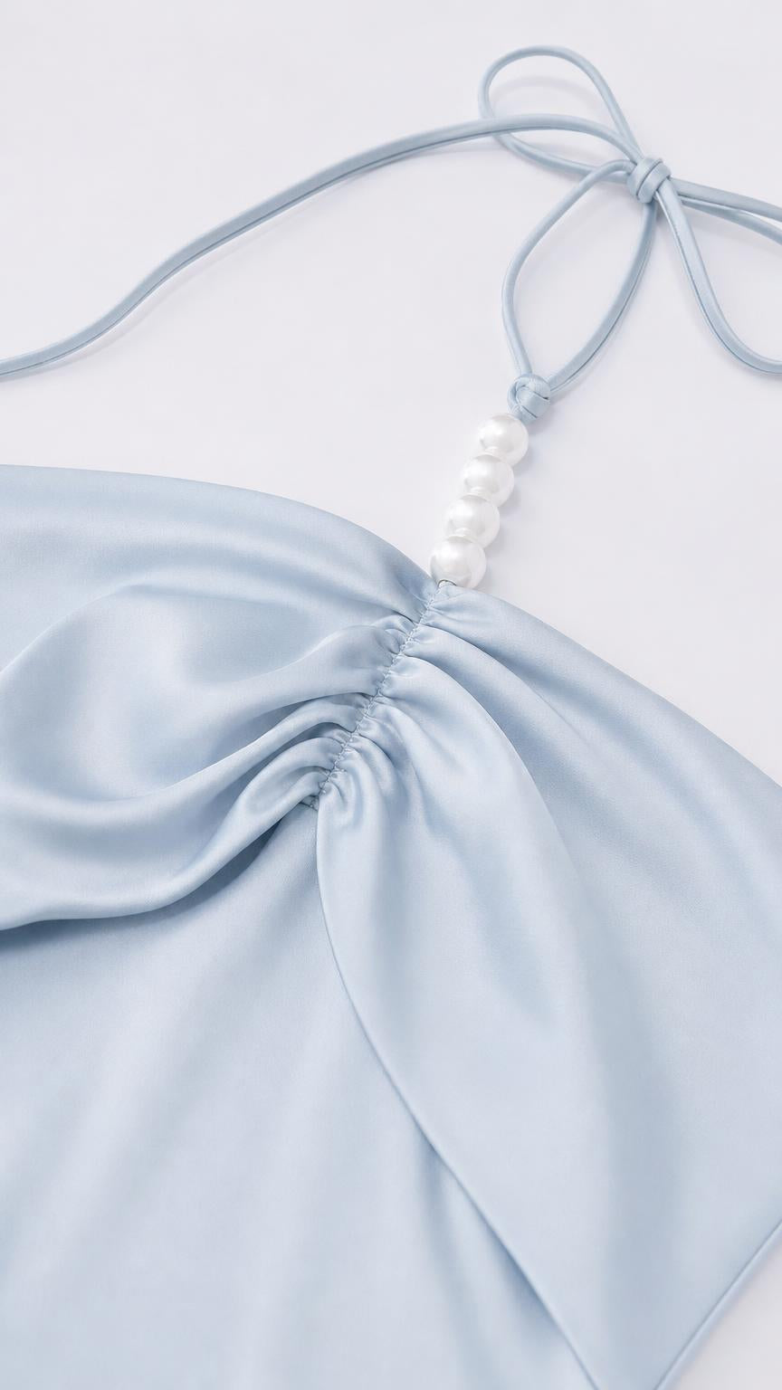 Close-up of halter strap with faux pearl embellishments and ruched bodice