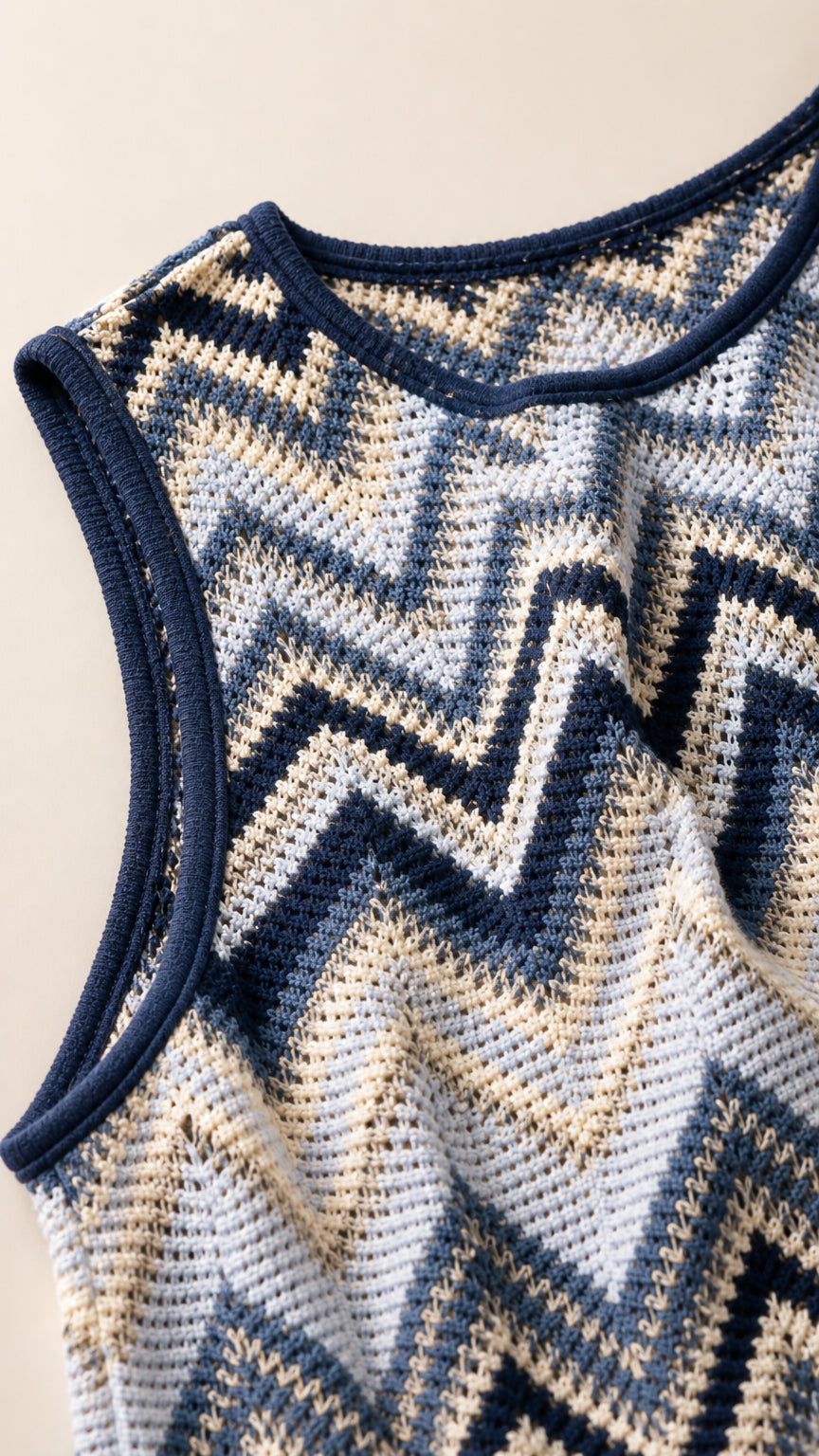 Close-up detail of blue chevron knit fabric and neckline