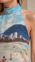 Close-up detail of blue coastal graphic on mock neck top