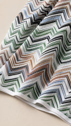 Close-up texture view of multi-color chevron knit fabric