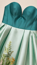 Close-up detail of the sweetheart bodice and embroidered skirt hem