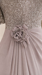 Close-up of sequin bodice and floral waist detail