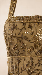 Close-up detail of metallic bead and sequin embroidery