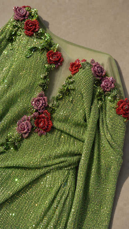 Close-up of 3D beaded rose appliques on green evening dress