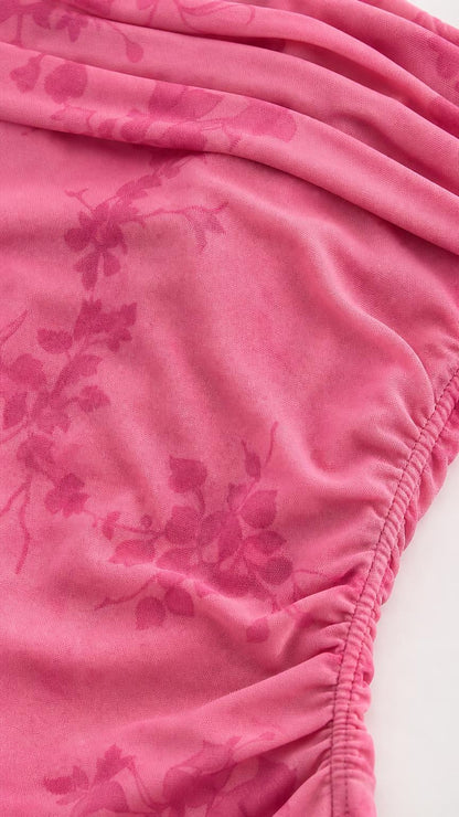 Close-up of pink fabric texture and floral pattern