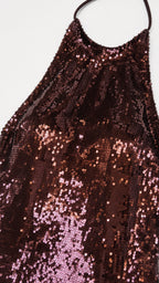 Close-up texture view of brown sequin fabric and halter strap