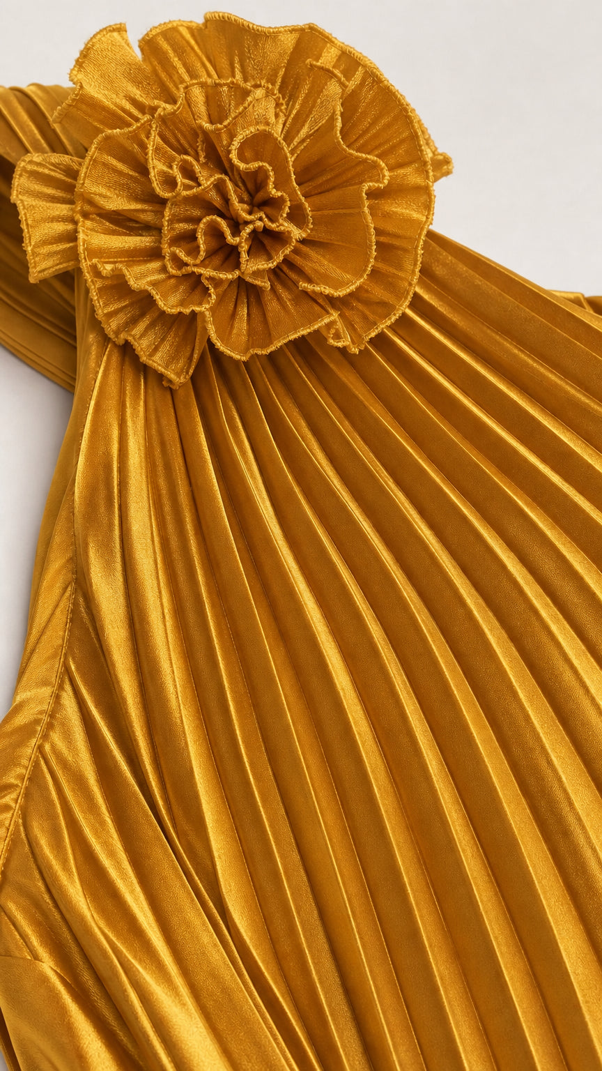 Close-up of shoulder rosette and pleating detail