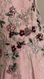 Close-up detail of floral embroidery and beadwork