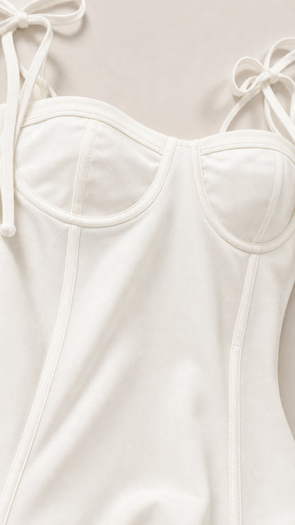 Close-up detail of structured sweetheart bodice and tie straps