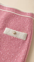 Close-up detail of pink sequin fabric and pocket accent