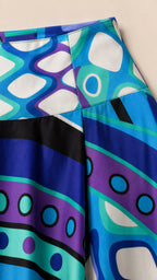 Close-up detail of the blue abstract pattern and waistband