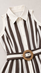Closeup of dress collar, buttons, and woven belt detail