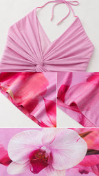 Close up of halter neck, twist front bodice, and floral fabric texture