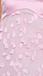 Close-up detail of satin bodice and 3D floral appliques