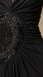 Close-up of intricate beaded waist medallion detail