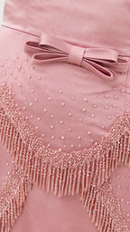 Close-up of beaded fringe and bow detail