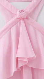Close-up of halter neckline and fabric rosette detail