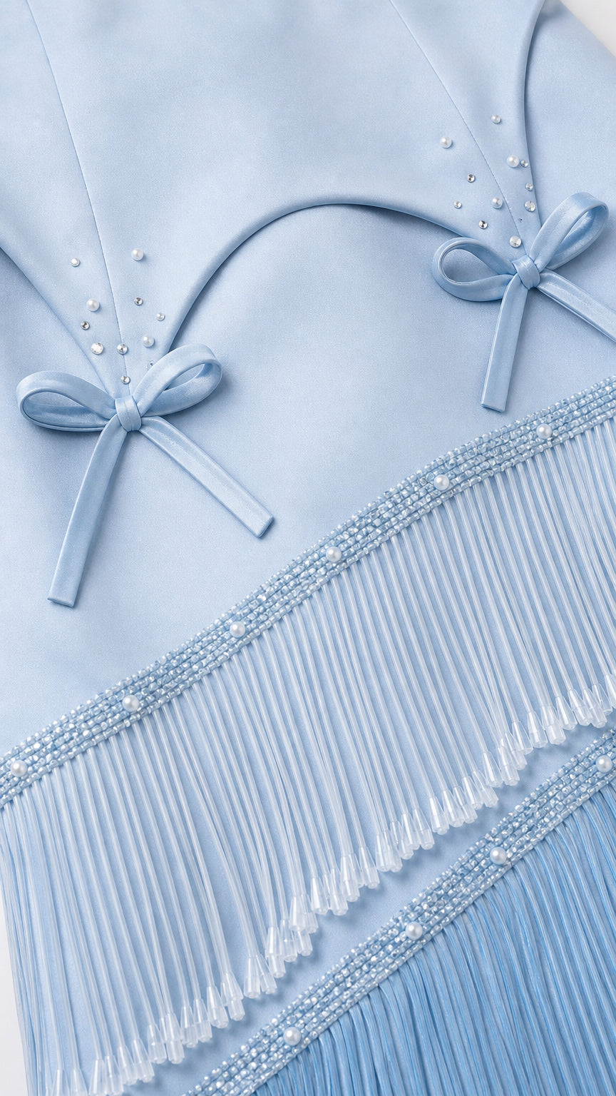 Close-up of bodice, bows, and beadwork on light blue gown