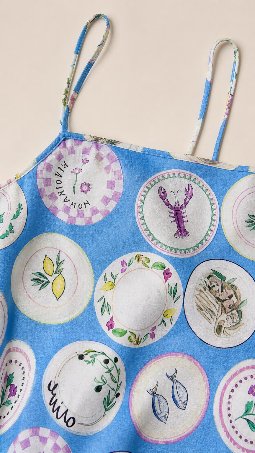 Close-up detail of blue printed fabric and straps