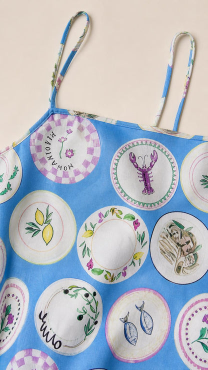 Close-up detail of blue printed fabric and straps