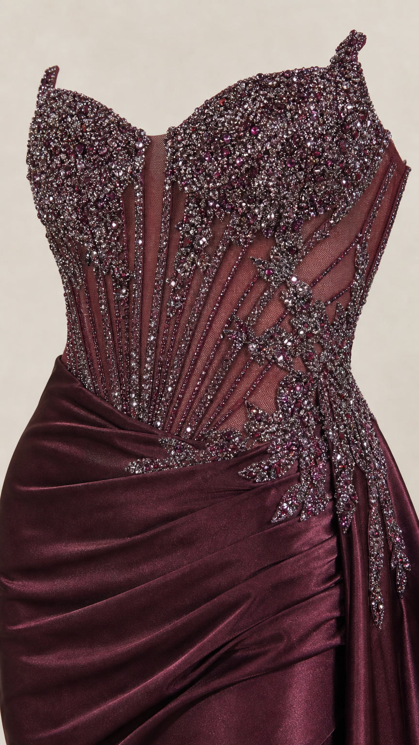 Close-up of beaded mesh corset bodice and draped satin hip