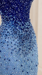 Close-up detail of dense blue ombre bead and sequin embellishment